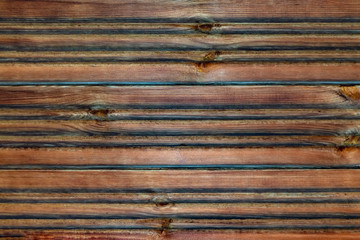 Dark wooden textured background. View from the front. Copy space.