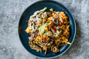 Mexican Food Carne Asada Steak Fillets, Guacamole Sauce, Pinto Beans and Rice.