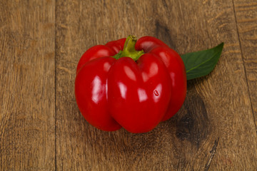 Ripe Red bell pepper over wooden