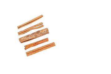 Cinnamon sticks lie on a white background, isolate.