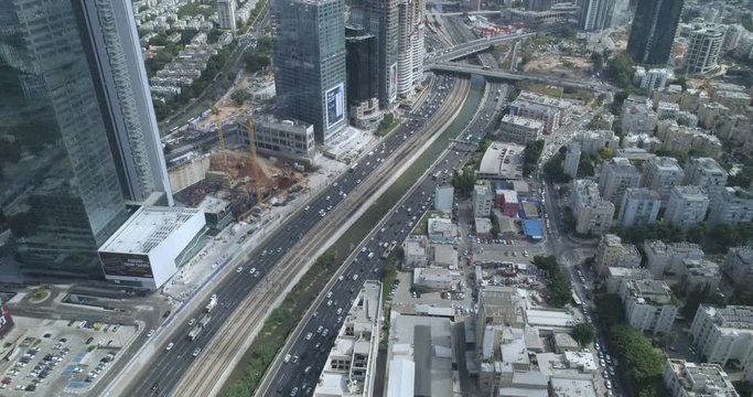 Tel Aviv highway road at daytime. Aerial drone view above Ayalon Highways car road with traffic in the middle of Modern city in Israel