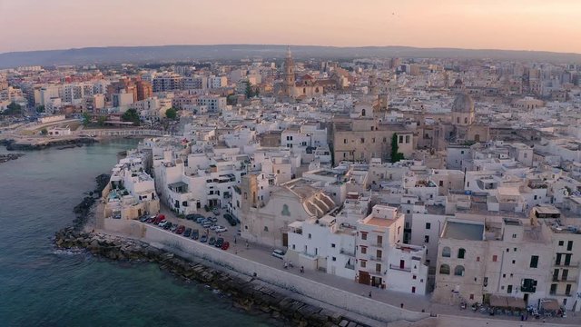 Flight over Monopoli at sunset, Apulia, Italy