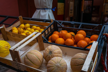 Cinque Terre, Italy. Fresh fruits. Lemon tree. Box of fruits on wooden street market counter.