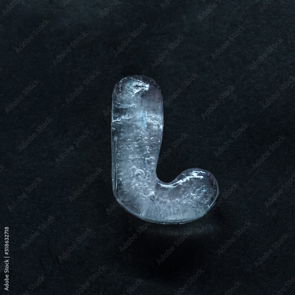 Fototapete melting speech. alphabet's shiny and well-structured letters made out of ice isolated on dark studio