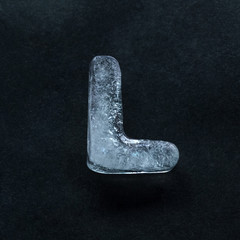 Melting speech. Alphabet's shiny and well-structured letters made out of ice isolated on dark...