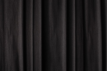 Fototapeta premium Texture of dark black corrugated thin uneven paper