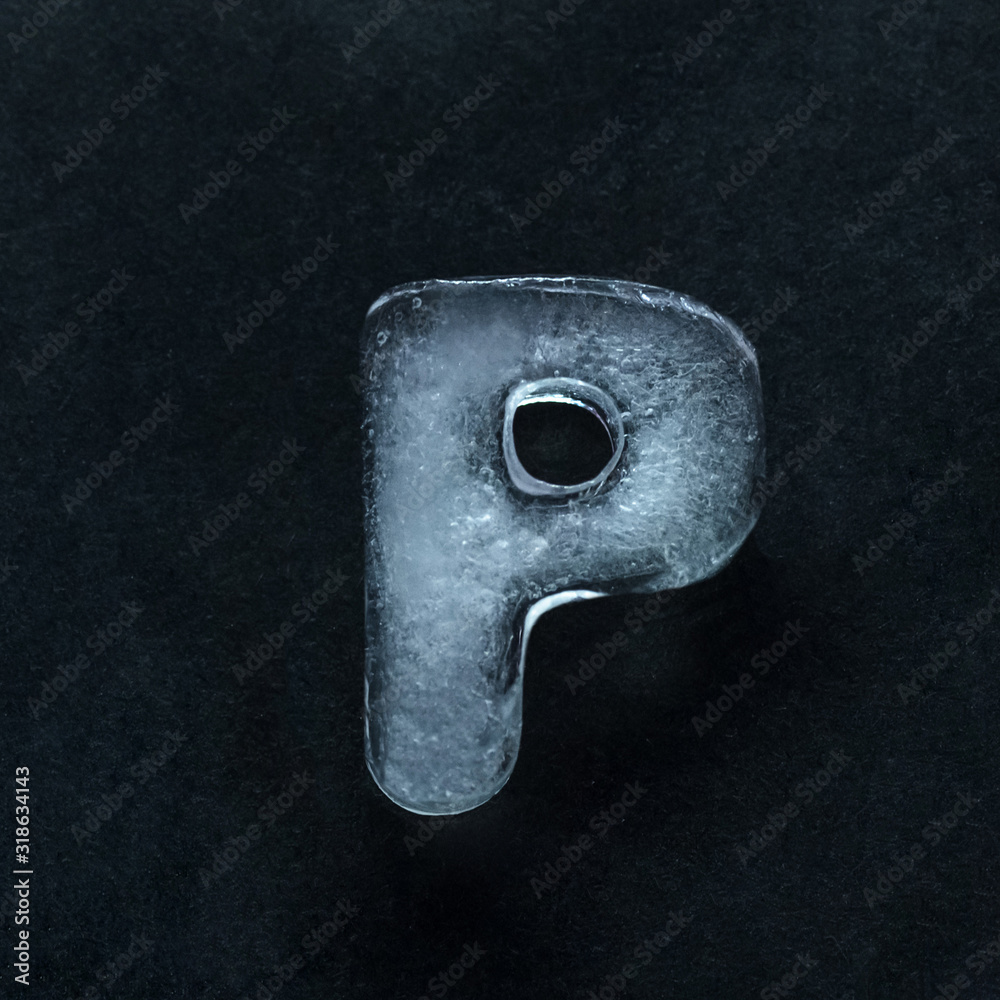 Fototapete melting speech. alphabet's shiny and well-structured letters made out of ice isolated on dark studio
