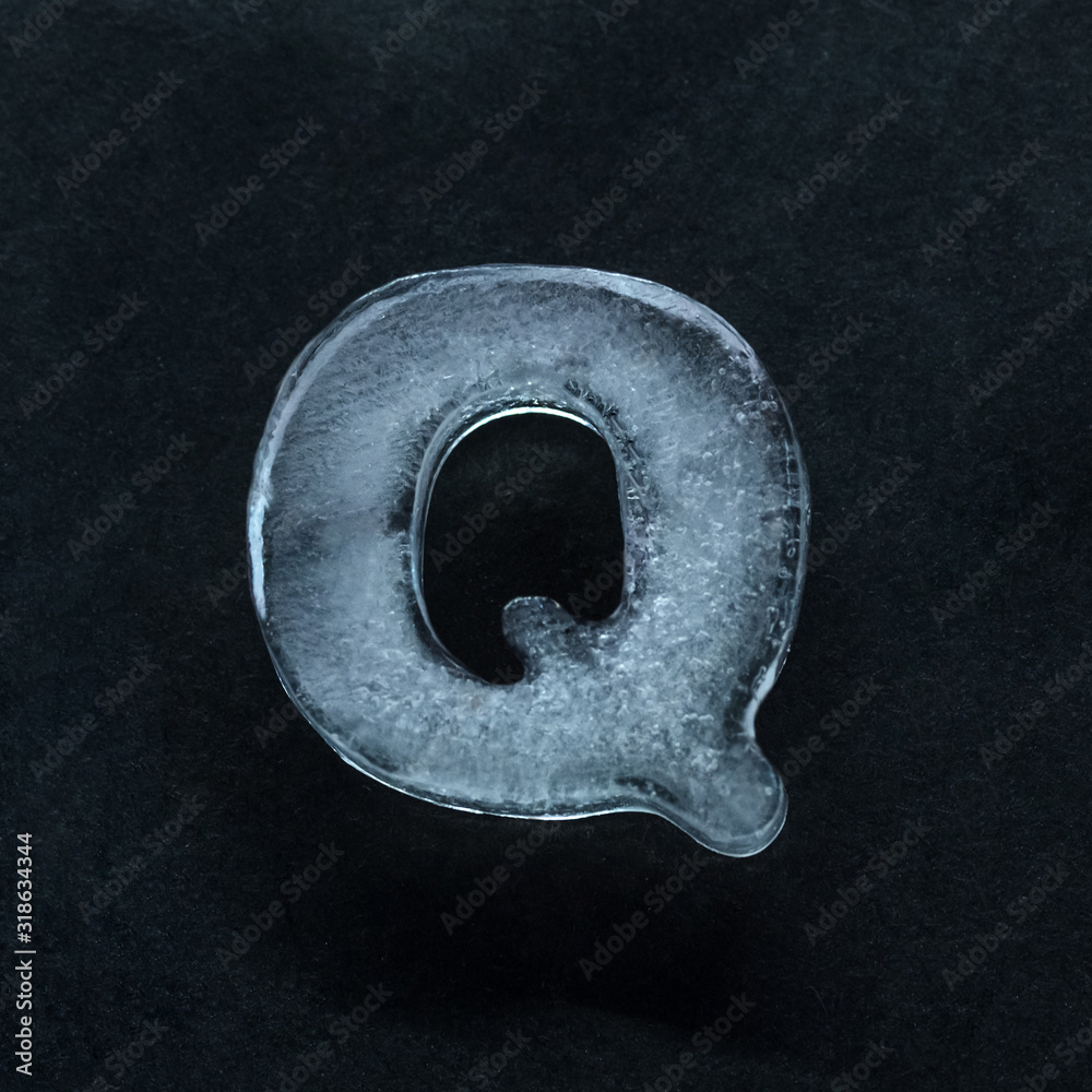Fototapete melting speech. alphabet's shiny and well-structured letters made out of ice isolated on dark studio