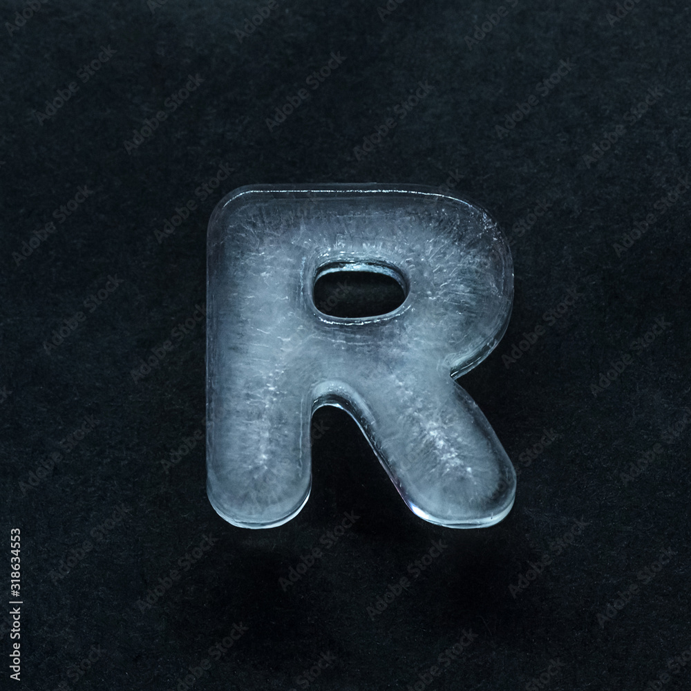 Fototapete melting speech. alphabet's shiny and well-structured letters made out of ice isolated on dark studio