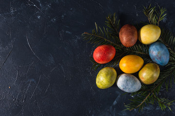 Multi-colored bright easter eggs. Easter. Easter eggs on a dark background Easter background....