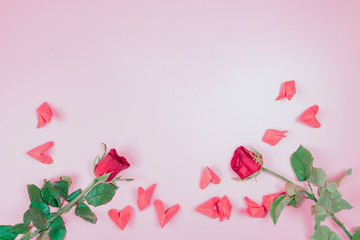 flat lay decorate design for valentine's day with red rose and small heart on pink pastel background and copy space