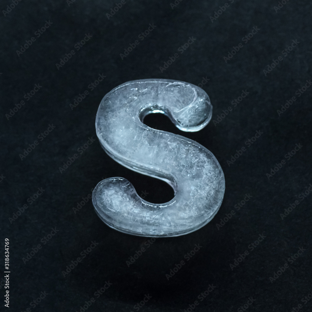 Fototapete melting speech. alphabet's shiny and well-structured letters made out of ice isolated on dark studio