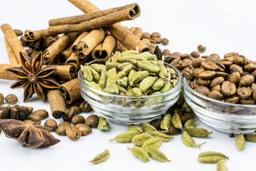 Cardamom and coffee beans, anise stars, cinnamon isolated on white background.