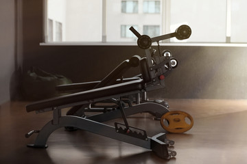 Abdominal bench in gym. Modern sport equipment