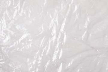 Background texture of a polyethylene transparent film on a white background