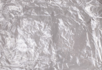 Background texture of a polyethylene transparent film on a white background