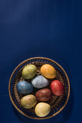  Multi-colored bright easter eggs. Easter. Easter eggs on a dark blue background Easter background....