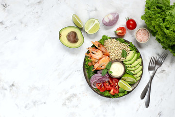 Healthy salad with green buckwheat, avocado, cucumber, tomato