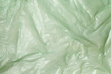 Background texture of a polyethylene transparent green film