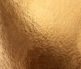 Texture of foiled gold paper with iridescence