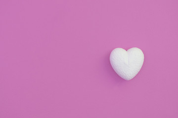 White hearts on a pink background