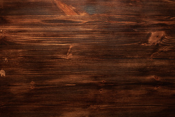 Background texture of old dark brown wood with defects