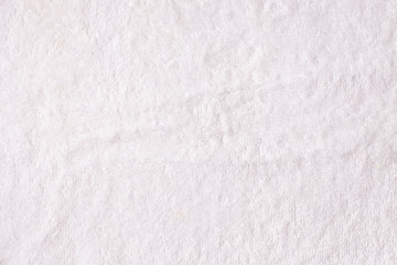 Fototapeta na wymiar Texture of terry white towel close-up