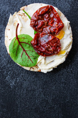 sun-dried tomatoes, sandwich appetizer snack (bruschetta) menu concept. background. top view. copy space
