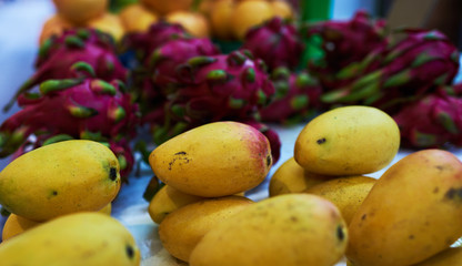 Big choice of fresh fruits and vegetables on market counter.