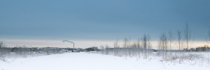 Fototapeta na wymiar Blue sky with snow field. Great background with copyspace. Winter and snow landscape. Stock photo.