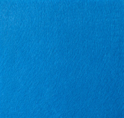 Fototapeta na wymiar Texture of a blue piece of felt large