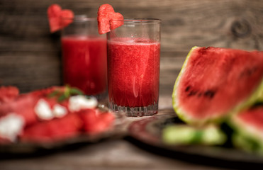 Fresh summer watermelon salad with feta cheese, arugula, onions on rustic background.