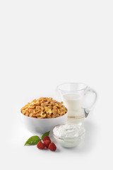 bowl of cereal with milk and glass of milk