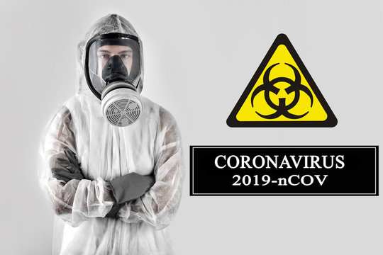 Coronavirus outbreak Chinese flu concept, man in special protective equipment and mask and biohazard sign on a white background isolated