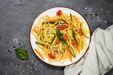 Pasta spaghetti with zucchini, carrot and tomato.