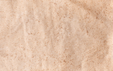Texture of old rough recycled Kraft brown paper with creases