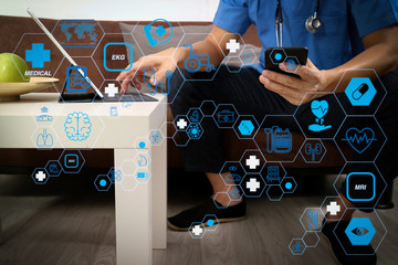 Medical and Health context,doctor hand working with smart phone,digital tablet computer,stethoscope,sitting on sofa in living room