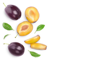 fresh purple plum and half with leaves isolated on white background with clipping path and copy spase for your text. Top view. Flat lay