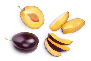 fresh purple plum and half isolated on white background with clipping path and full depth of field. Top view. Flat lay