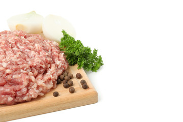 Cutting board with minced meat and spices isolated on white background
