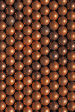 The surface of the many balls for shooting from an air gun. View from above. Background or wallpaper. Macro
