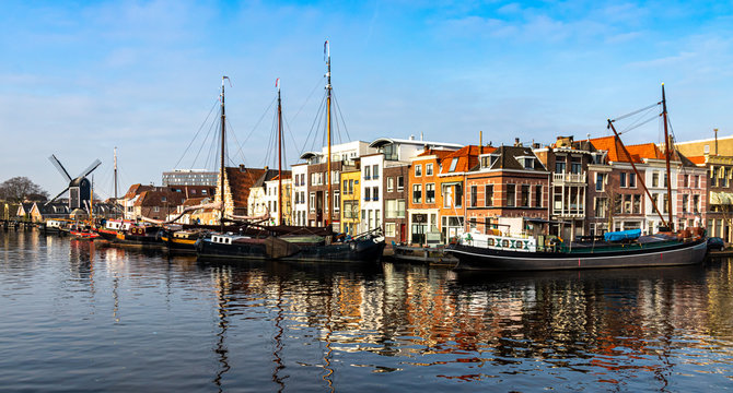 Boats in harbor Leiden blue sky