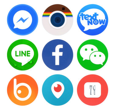 Kiev, Ukraine - April 22, 2016: Collection of popular round social networking icons, printed on paper: Facebook, Messenger, Text Now, Line, Periscope and others