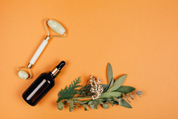 Modern apothecary with natural ingredients. Oil made of herbs herbs. Face roller for self-care....