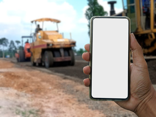 Blank screen smartphone And the background blur of the road construction