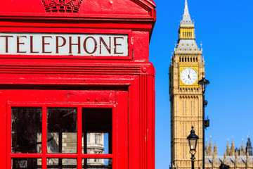 Fototapeta na wymiar Iconic red telephone box with Big Ben in the background