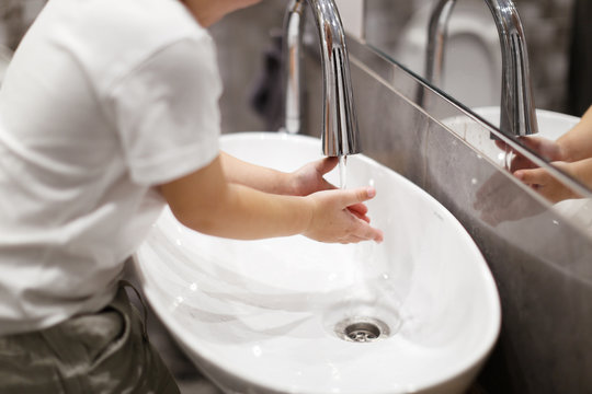 Fun Kid Wash Hands In Real Interior Bathroom