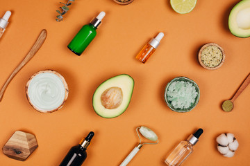 Modern accessories and herbal cosmetics for natural face care. Flat lay style.