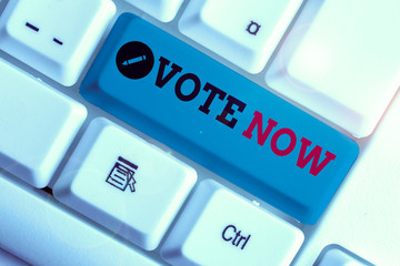 Conceptual hand writing showing Vote Now. Concept meaning formal indication of choice between two...