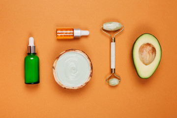 Modern accessories and herbal cosmetics for natural face care. Flat lay style.